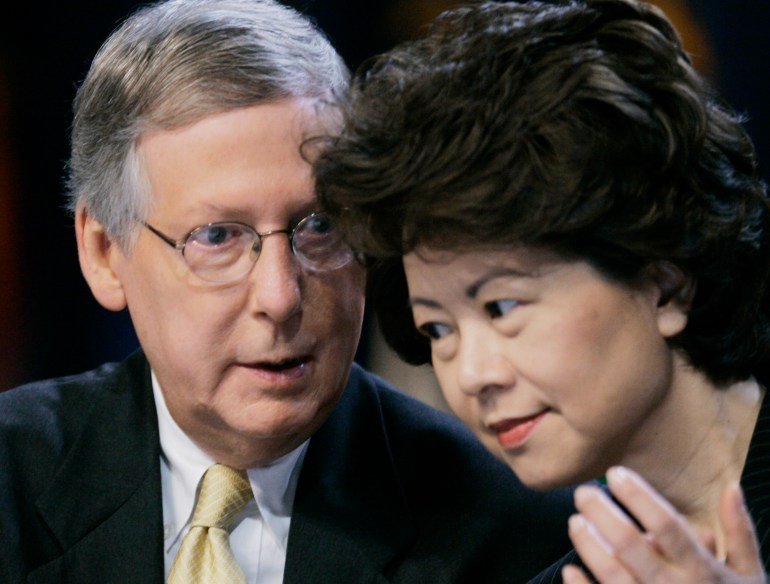 Mitch McConnell speaks to his wife Elaine Chao