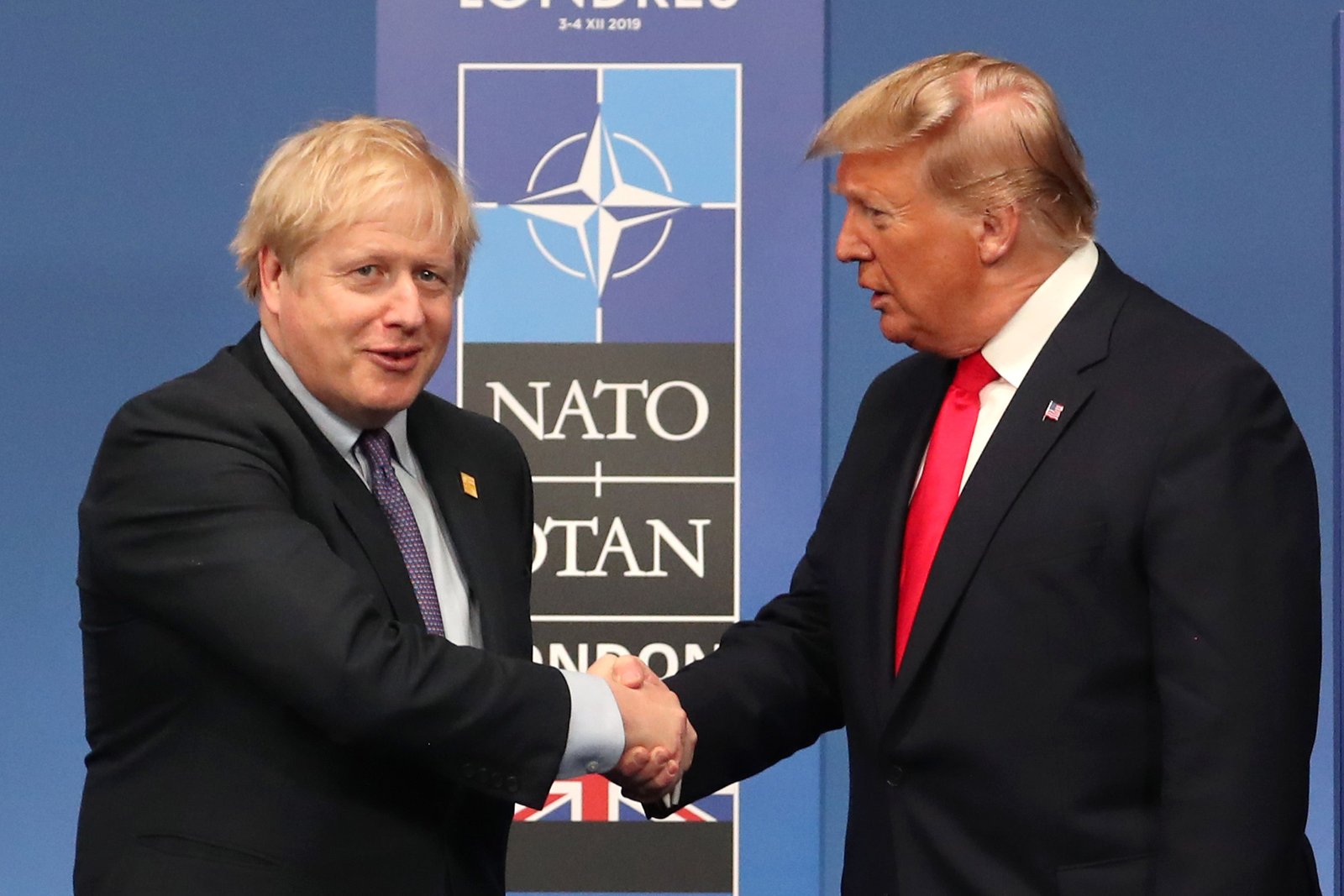 Boris Johnson shakes hands with Donald Trump